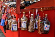 Dominican Mama Juana Dominican Mama Juana bottles in a street stand.