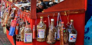 Dominican Mama Juana Dominican Mama Juana bottles in a street stand.