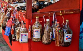 Dominican Mama Juana Dominican Mama Juana bottles in a street stand.
