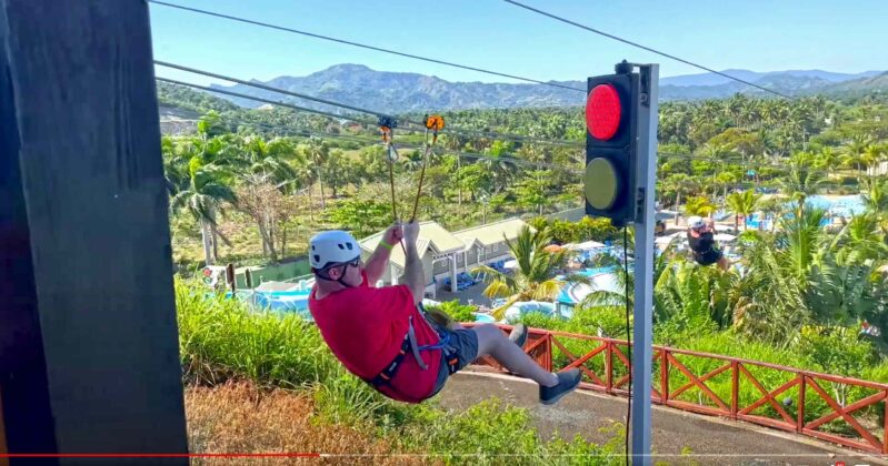 Red light on as a man launches down the zip line